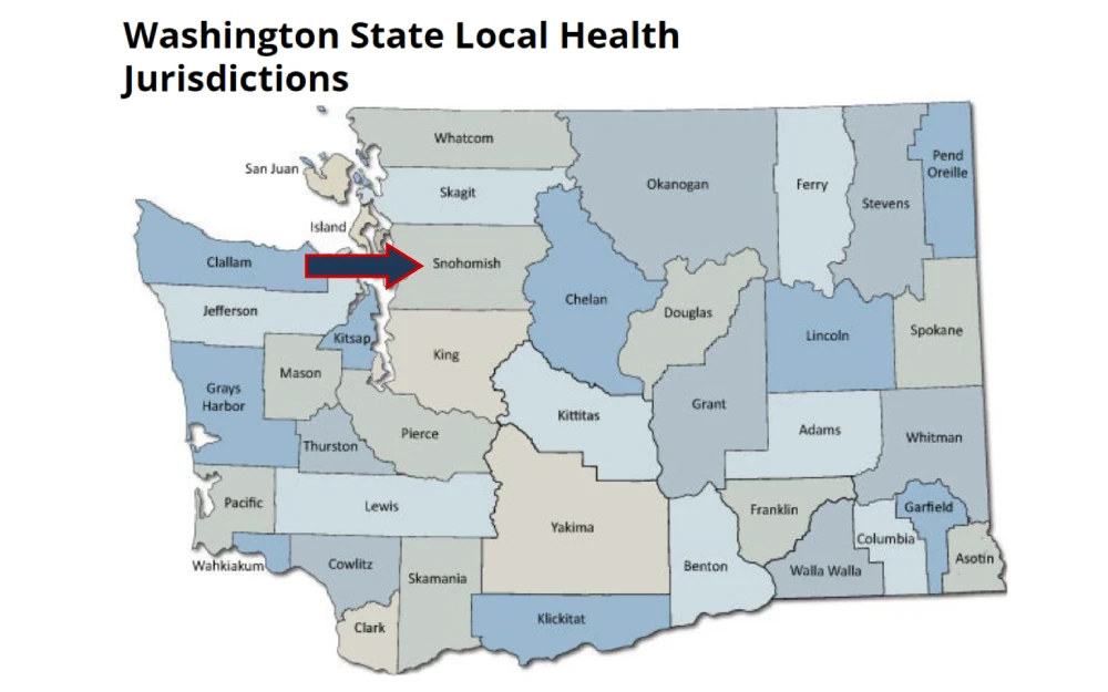 A screenshot displaying a Washington state map showing the locations of local health jurisdictions such as Whatcom, Okanogan, Ferry, Chelan, Douglas, Lincoln, San Juan, Clallam, Yakima, Benton and others.